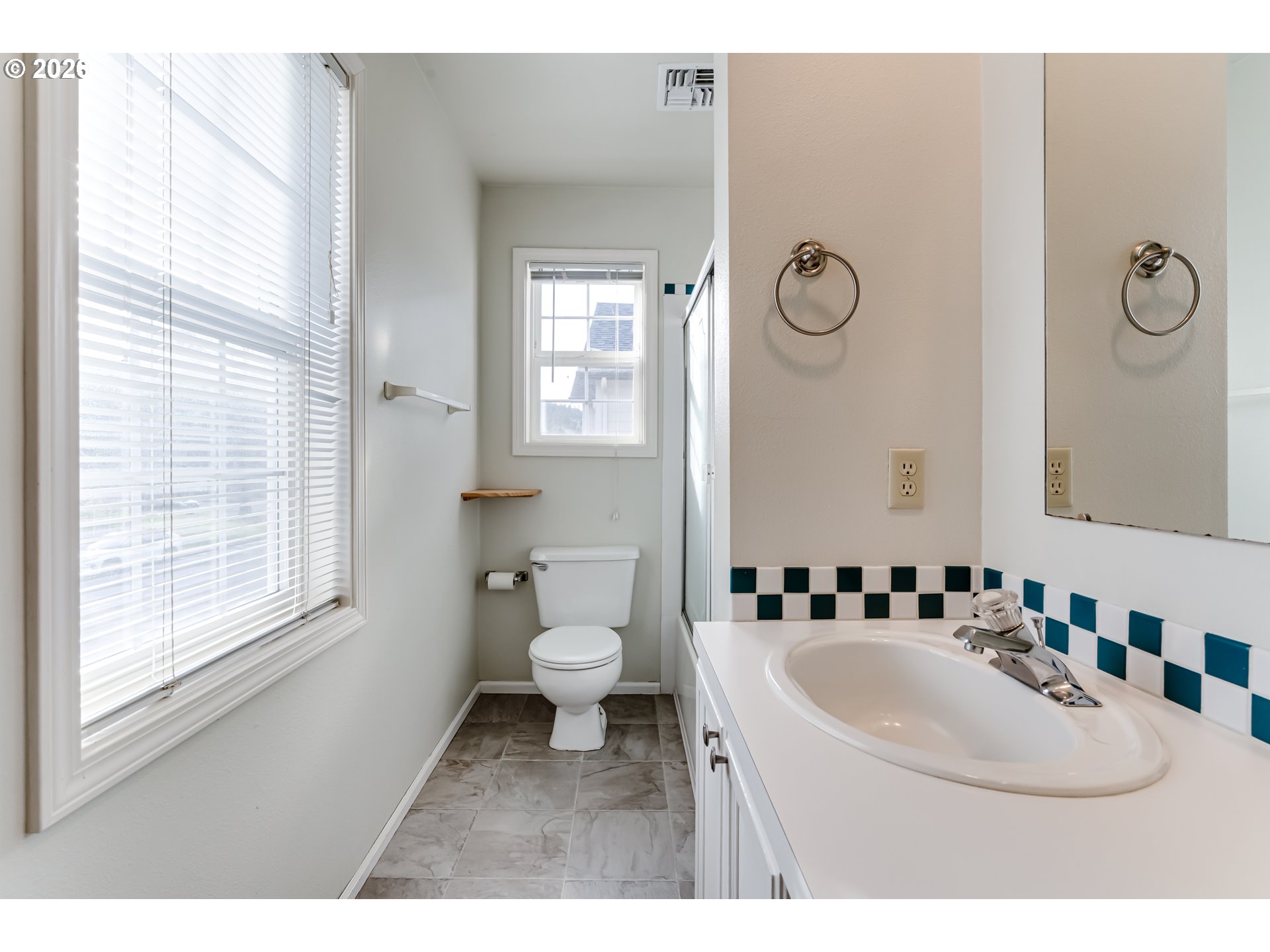 951 West 27th Avenue Eugene, OR 97405 - Photo 27 of 34 a bathroom with a sink toilet and a mirror