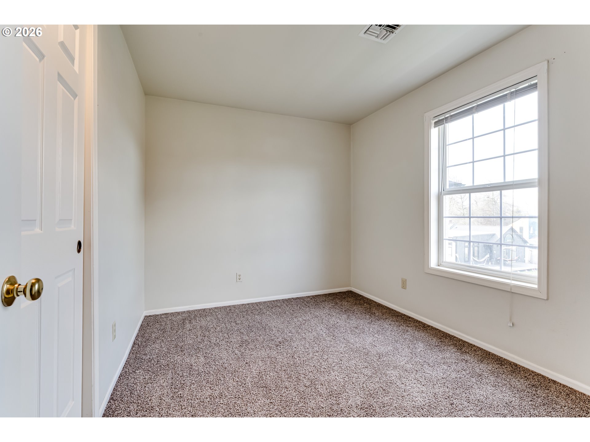 951 West 27th Avenue Eugene, OR 97405 - Photo 32 of 34 a view of an empty room with a window
