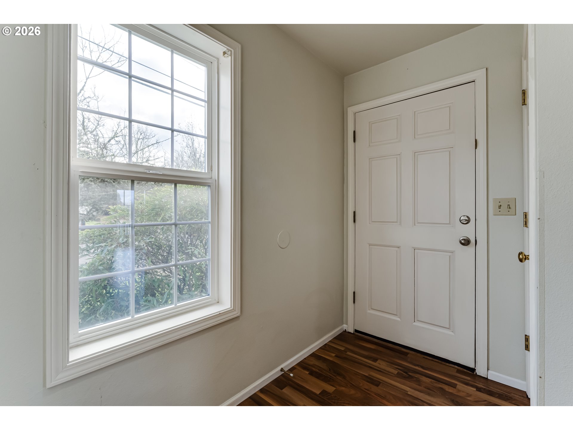 951 West 27th Avenue Eugene, OR 97405 - Photo 5 of 34 an empty room with wooden floor and windows