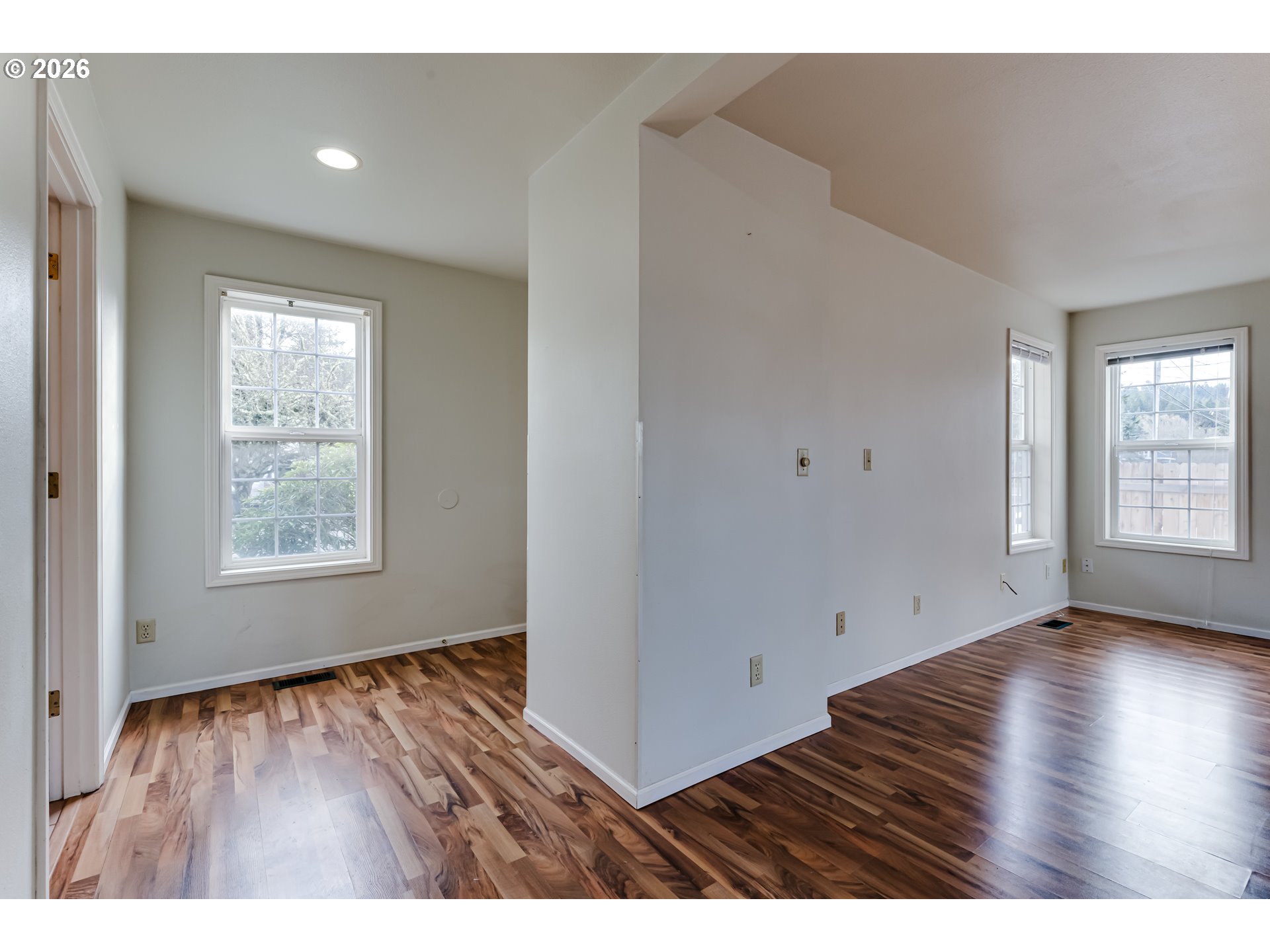 951 West 27th Avenue Eugene, OR 97405 - Photo 6 of 34 a view of an empty room with wooden floor and a window