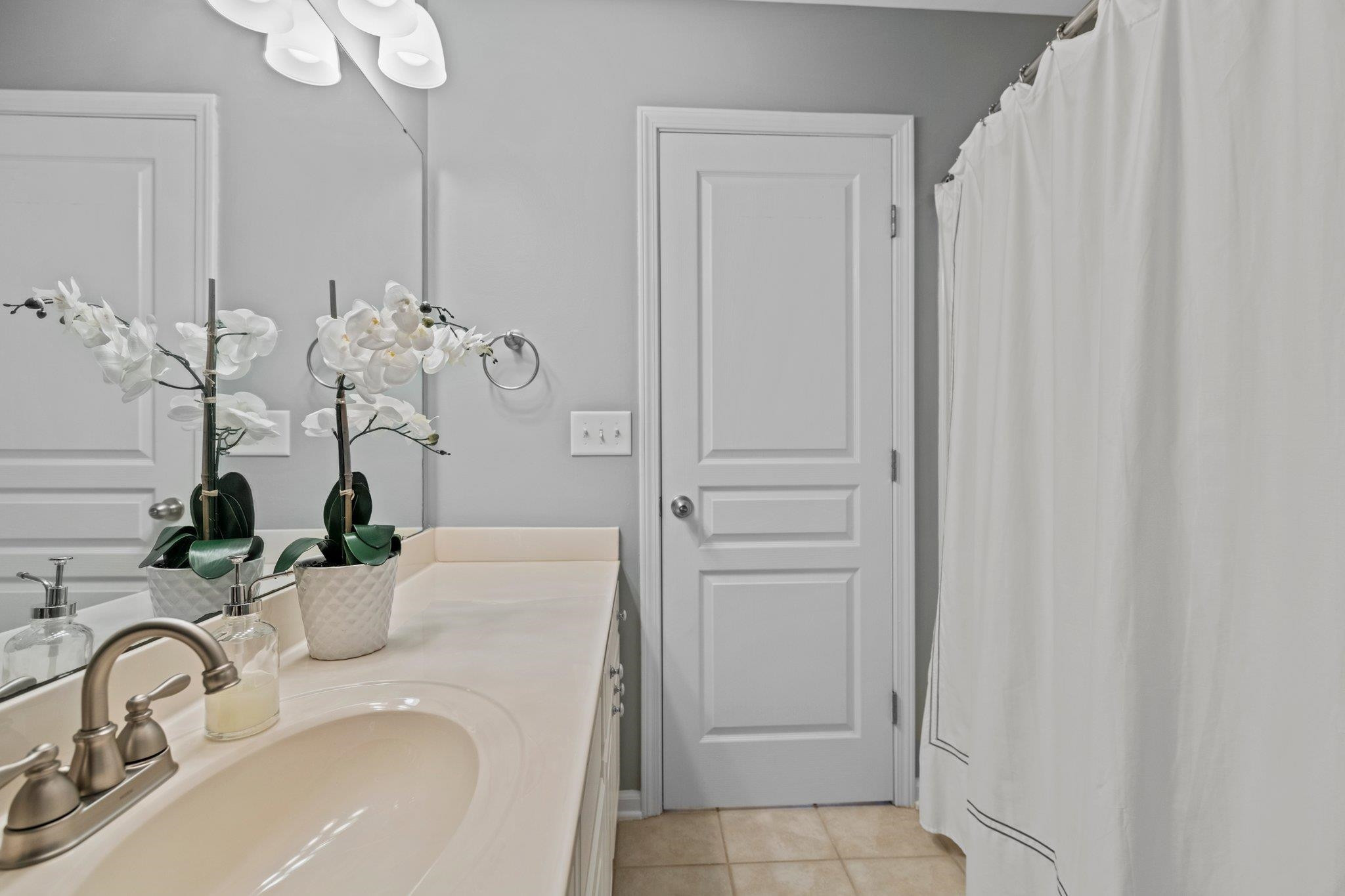 5105 Singing Wind Drive Raleigh, NC 27612 - Photo 15 of 21 Private owners bathroom displays beautiful lighting, additional counter space, under-cabinet storage space OWNERS BATHROOM
