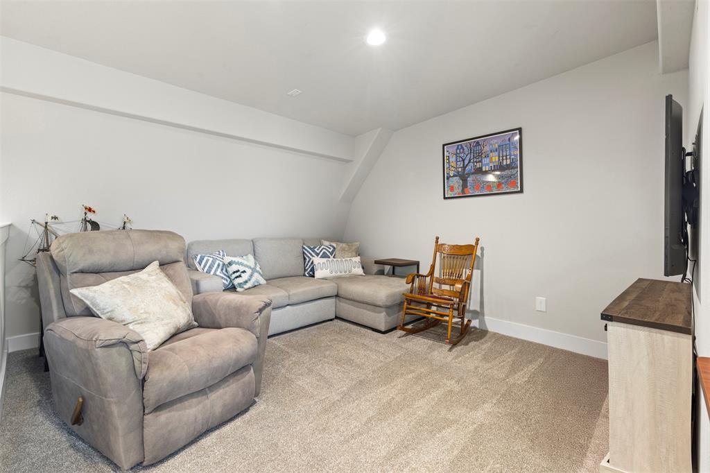 4906 Live Oak Street, Unit 7 Dallas, TX 75206 - Photo 12 of 19 a living room with furniture and a window