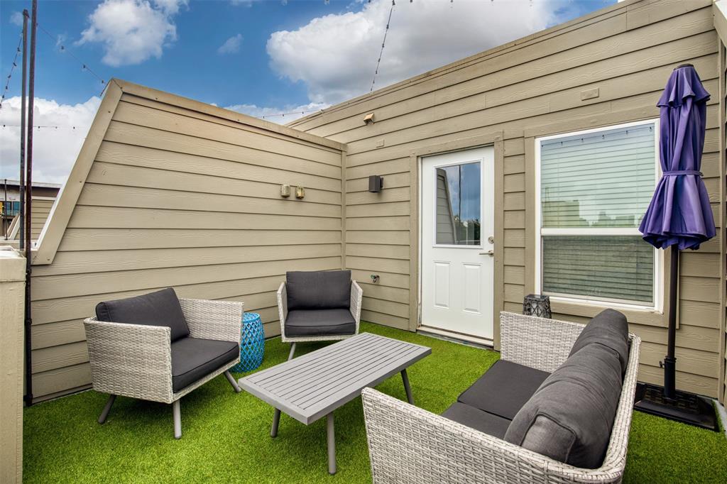 4906 Live Oak Street, Unit 7 Dallas, TX 75206 - Photo 16 of 19 a view of a patio with couches chairs and a table