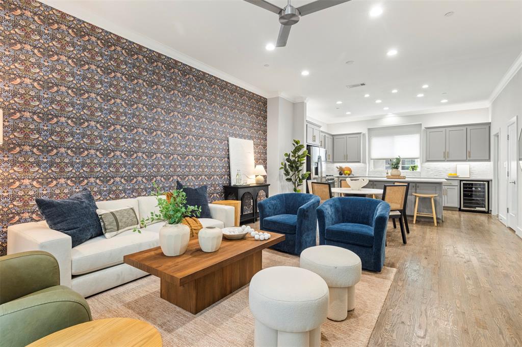 4906 Live Oak Street, Unit 7 Dallas, TX 75206 - Photo 5 of 19 a living room with furniture kitchen view and a wooden floor
