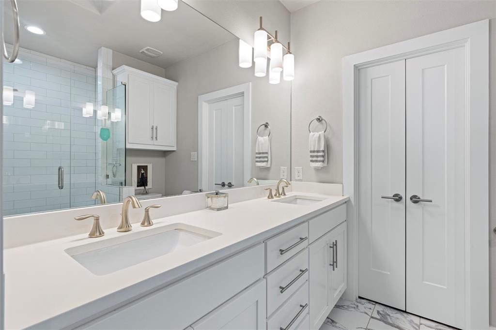 4906 Live Oak Street, Unit 7 Dallas, TX 75206 - Photo 9 of 19 a bathroom with double vanity sinks and a mirror