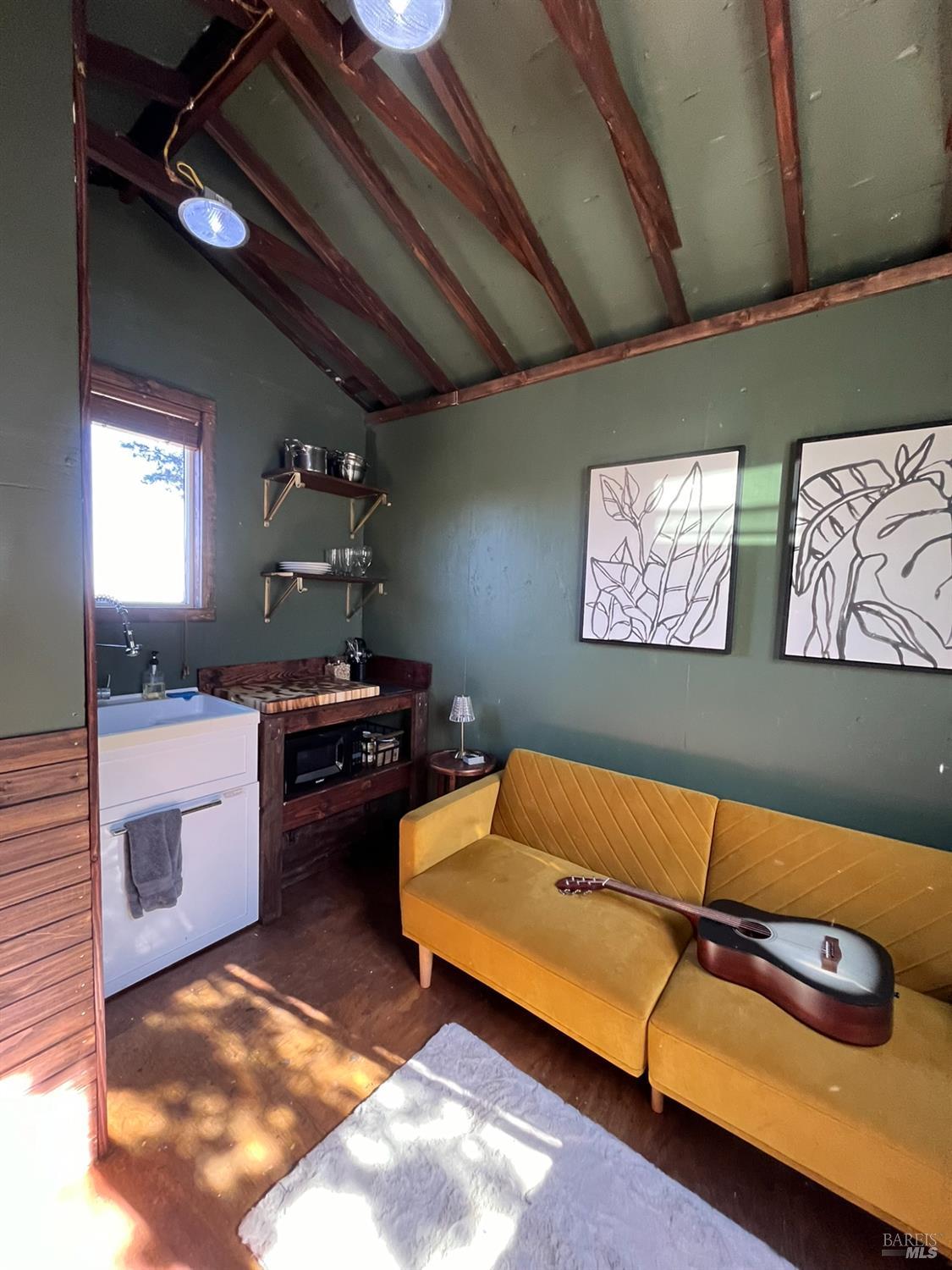 6775 County Road 110 Hopland, CA 95449 - Photo 30 of 53 a blue bed sitting in a room next to a window