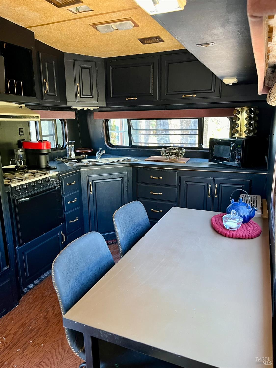 6775 County Road 110 Hopland, CA 95449 - Photo 40 of 53 a kitchen with stainless steel appliances a stove a sink and a refrigerator
