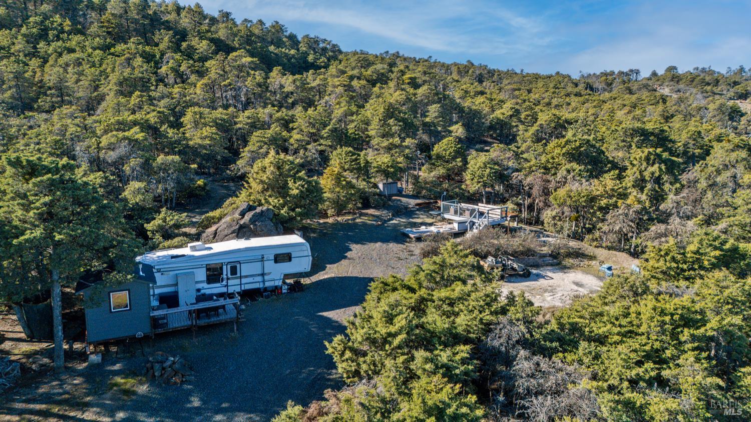6775 County Road 110 Hopland, CA 95449 - Photo 51 of 53 a view of a house with a yard and sitting area