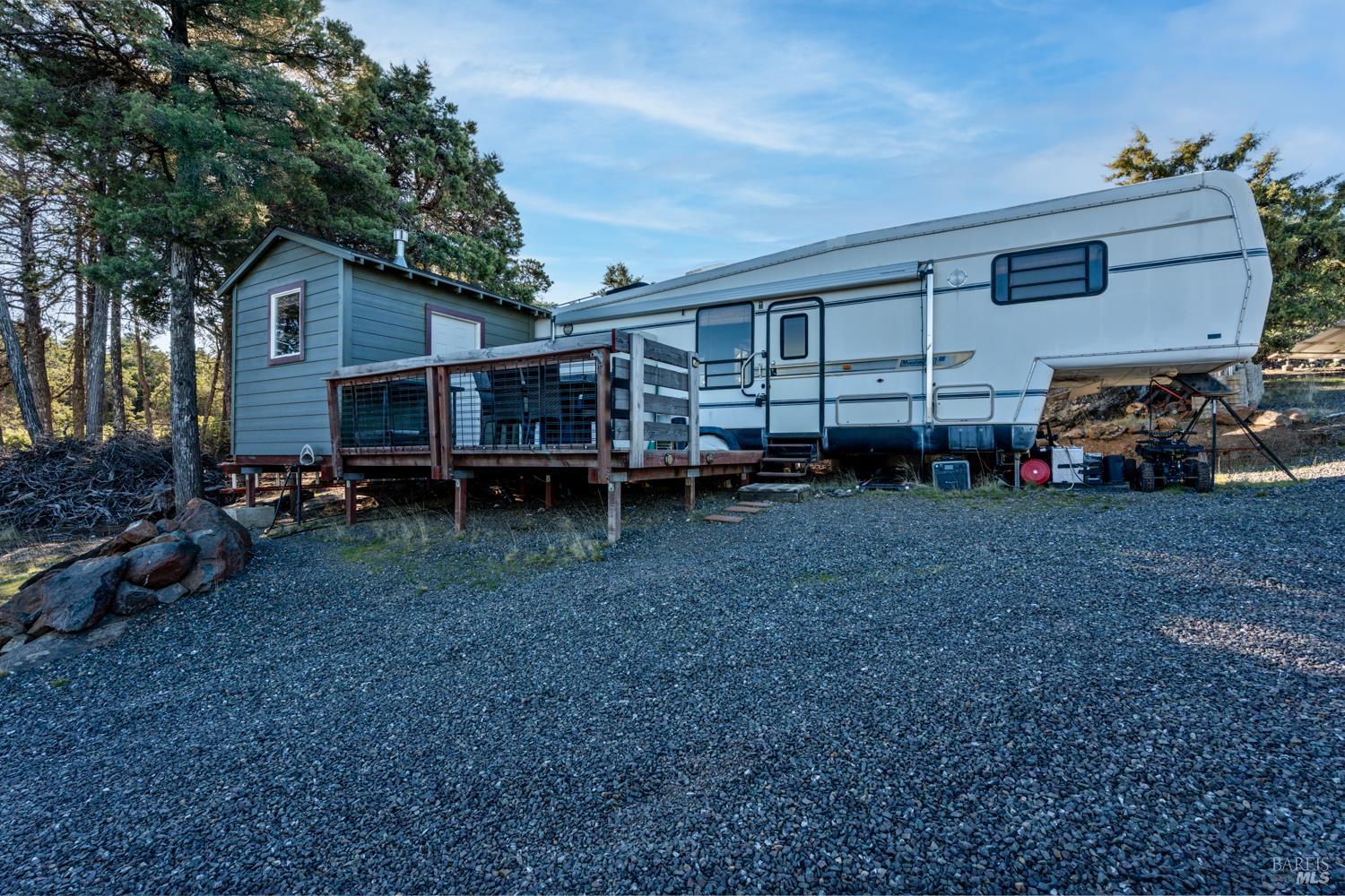 6775 County Road 110 Hopland, CA 95449 - Photo 8 of 53 a view of a house with a backyard and chairs