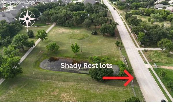 an aerial view of a house a garden and street view