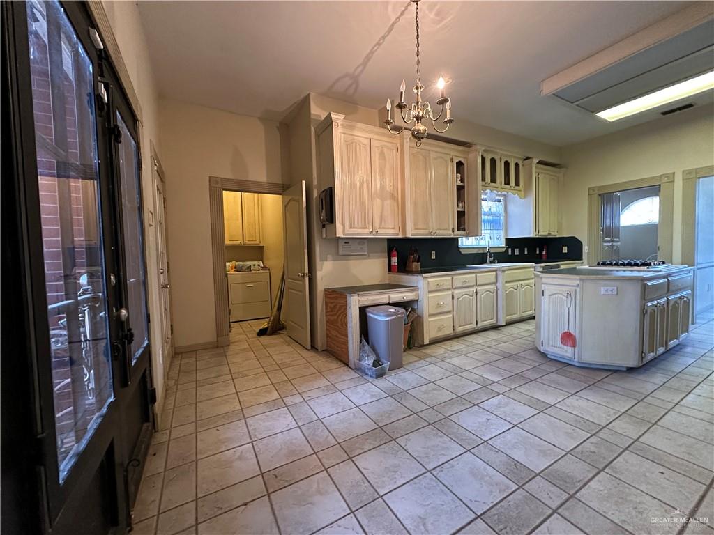 1215 South Tower Road Alamo, TX 78516 - Photo 13 of 41 a kitchen with stainless steel appliances a sink and cabinets