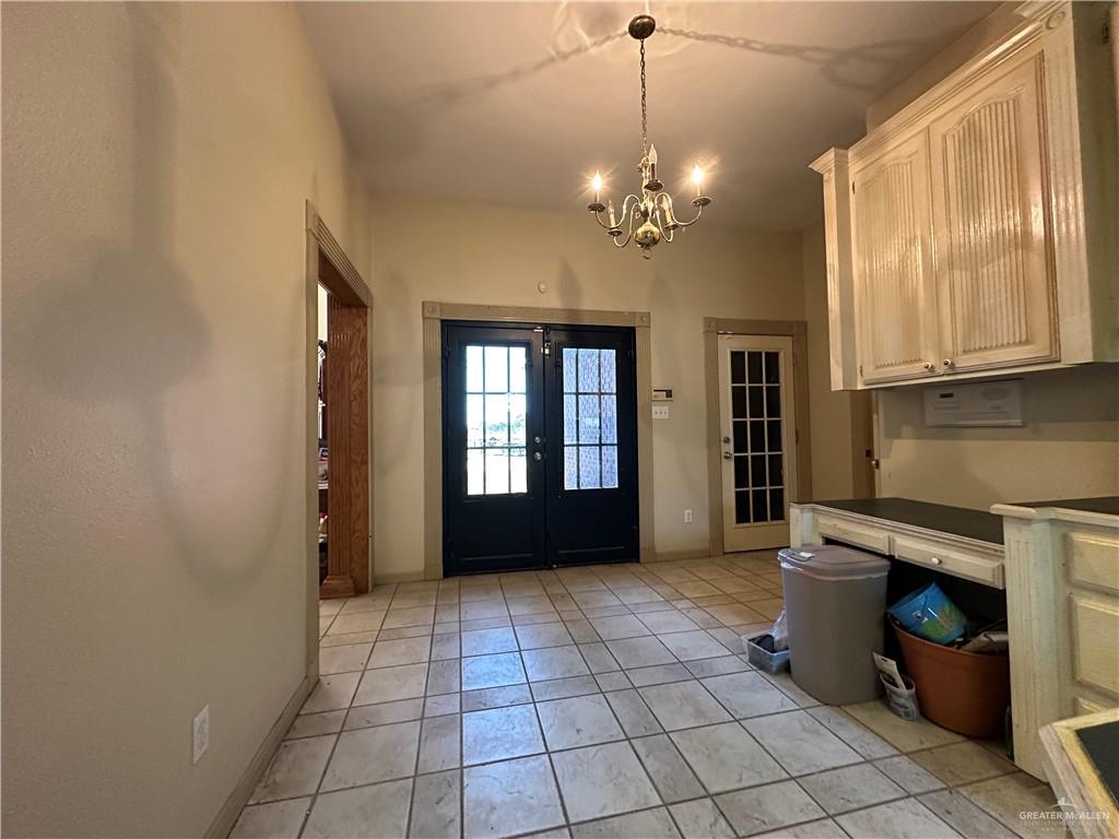 1215 South Tower Road Alamo, TX 78516 - Photo 14 of 41 a view of a livingroom with a chandelier