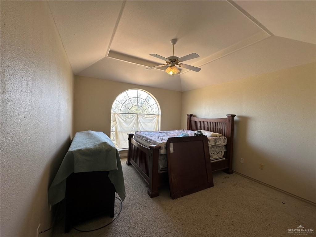 1215 South Tower Road Alamo, TX 78516 - Photo 20 of 41 a living room with furniture and a chandelier