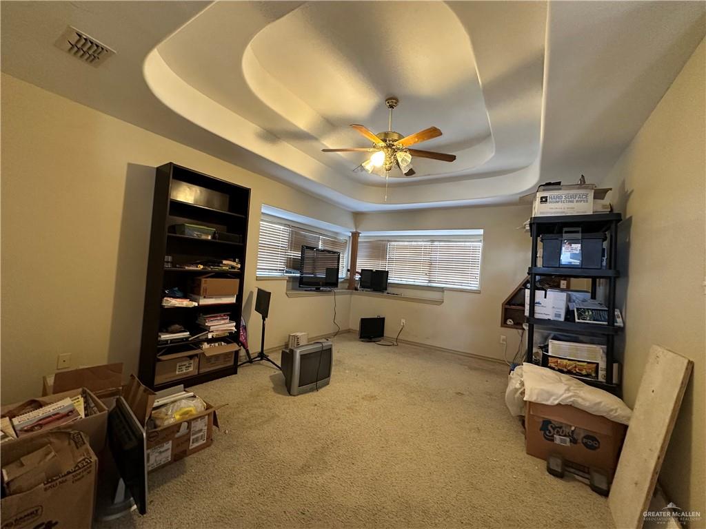 1215 South Tower Road Alamo, TX 78516 - Photo 26 of 41 a view of a livingroom with furniture and a ceiling fan
