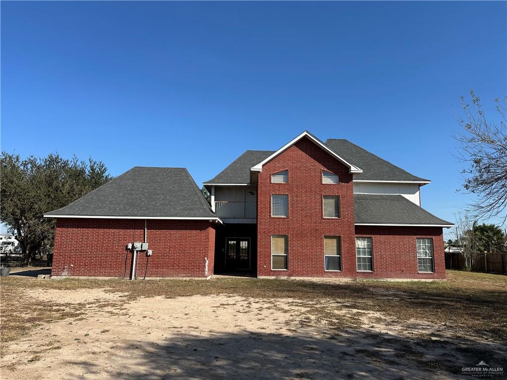1215 South Tower Road Alamo, TX 78516 - Photo 35 of 41 a front view of a house with a yard