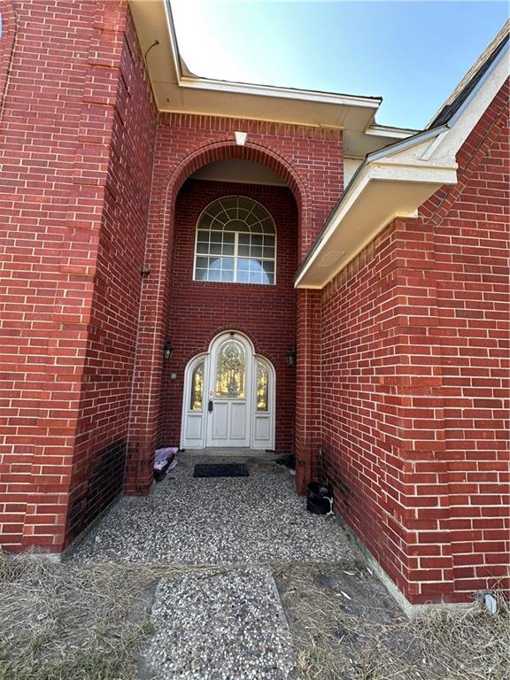 1215 South Tower Road Alamo, TX 78516 - Photo 5 of 41 a front view of a house with garden