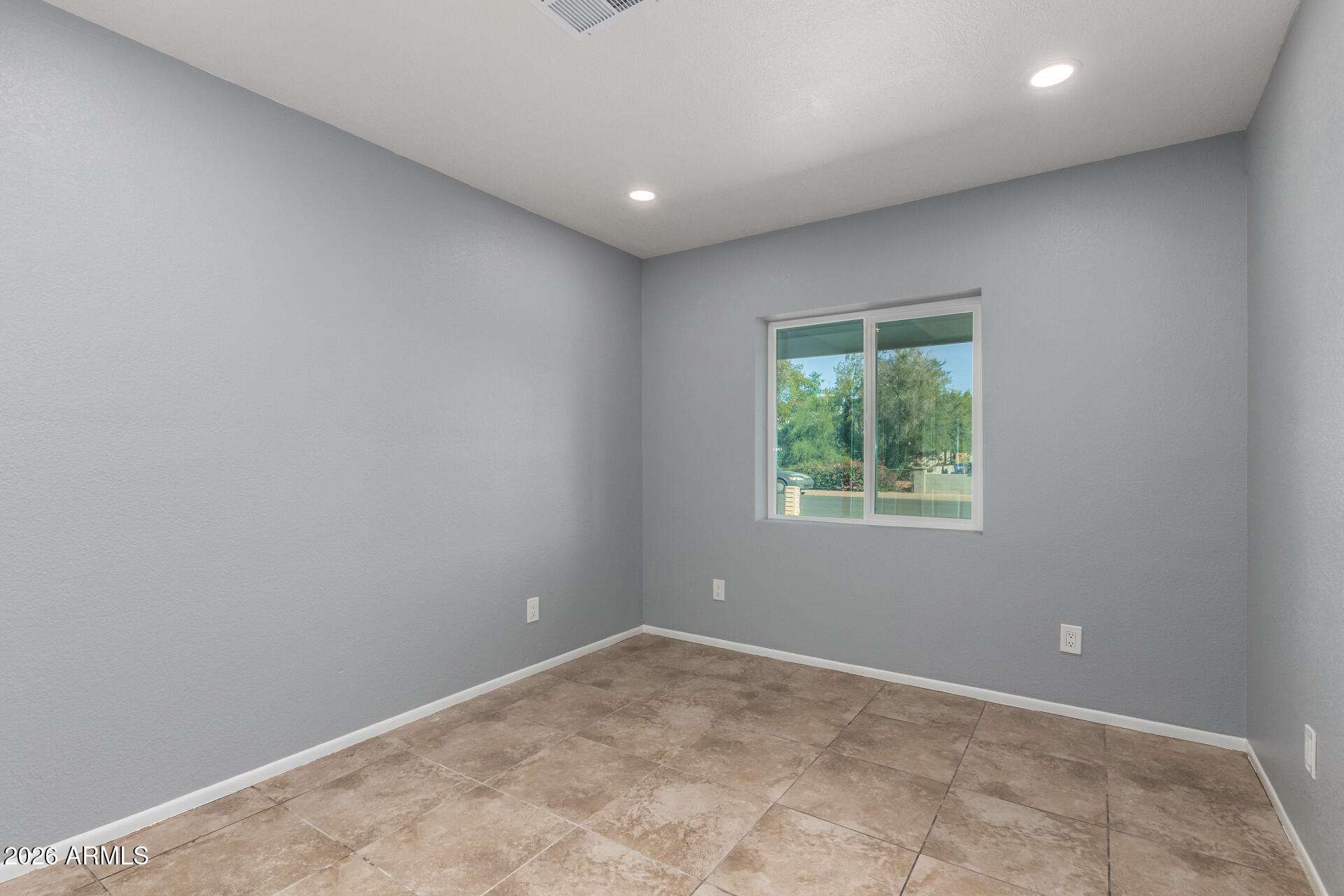 3802 North 79th Avenue Phoenix, AZ 85033 - Photo 14 of 28 an empty room with a window