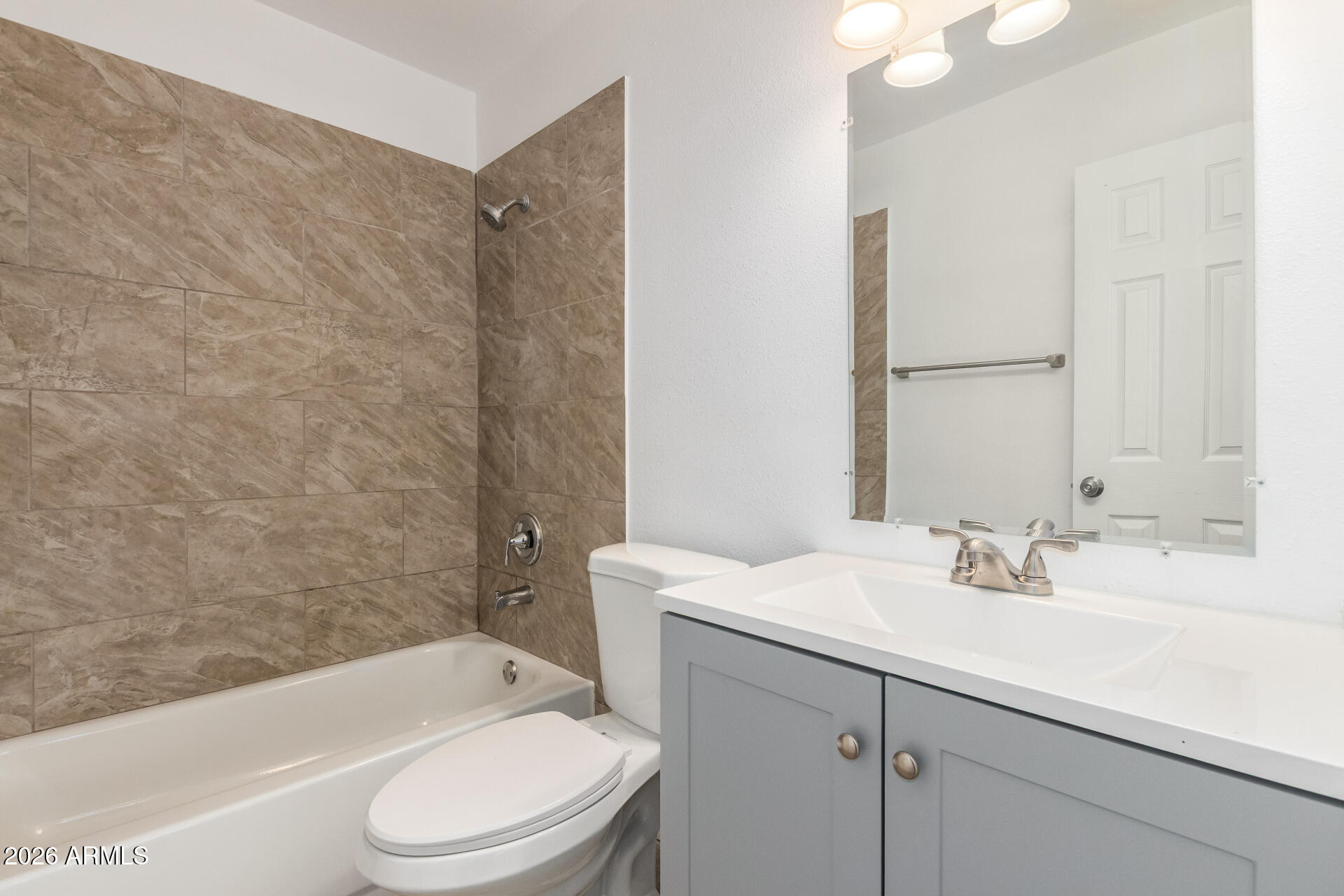 3802 North 79th Avenue Phoenix, AZ 85033 - Photo 15 of 28 a bathroom with a sink a toilet and shower