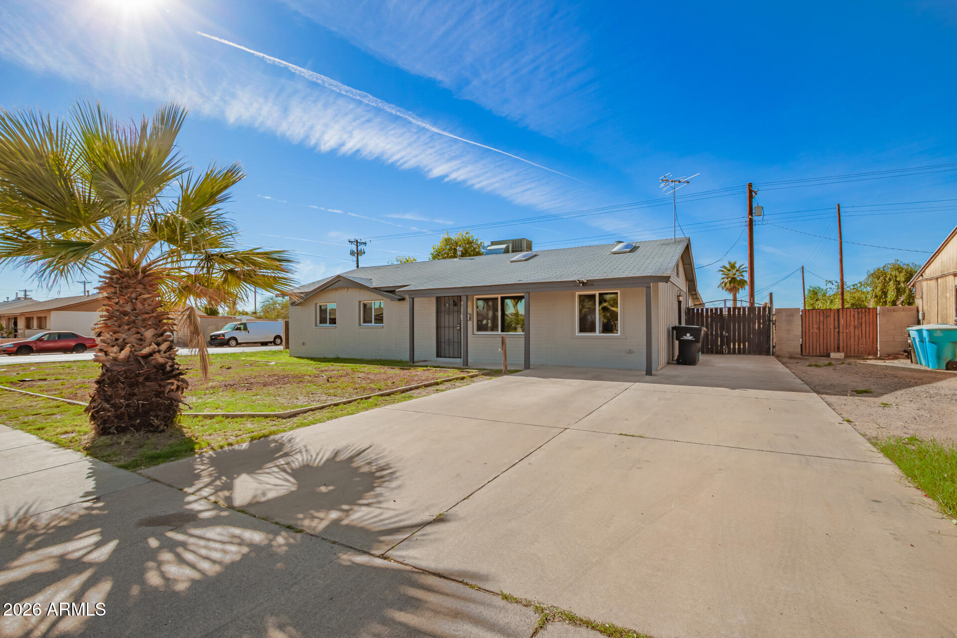 3802 North 79th Avenue Phoenix, AZ 85033 - Photo 2 of 28 a front view of a house with a yard