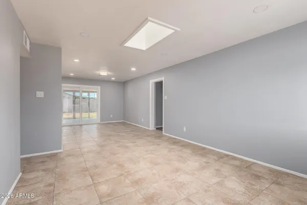 a view of an empty room with a window