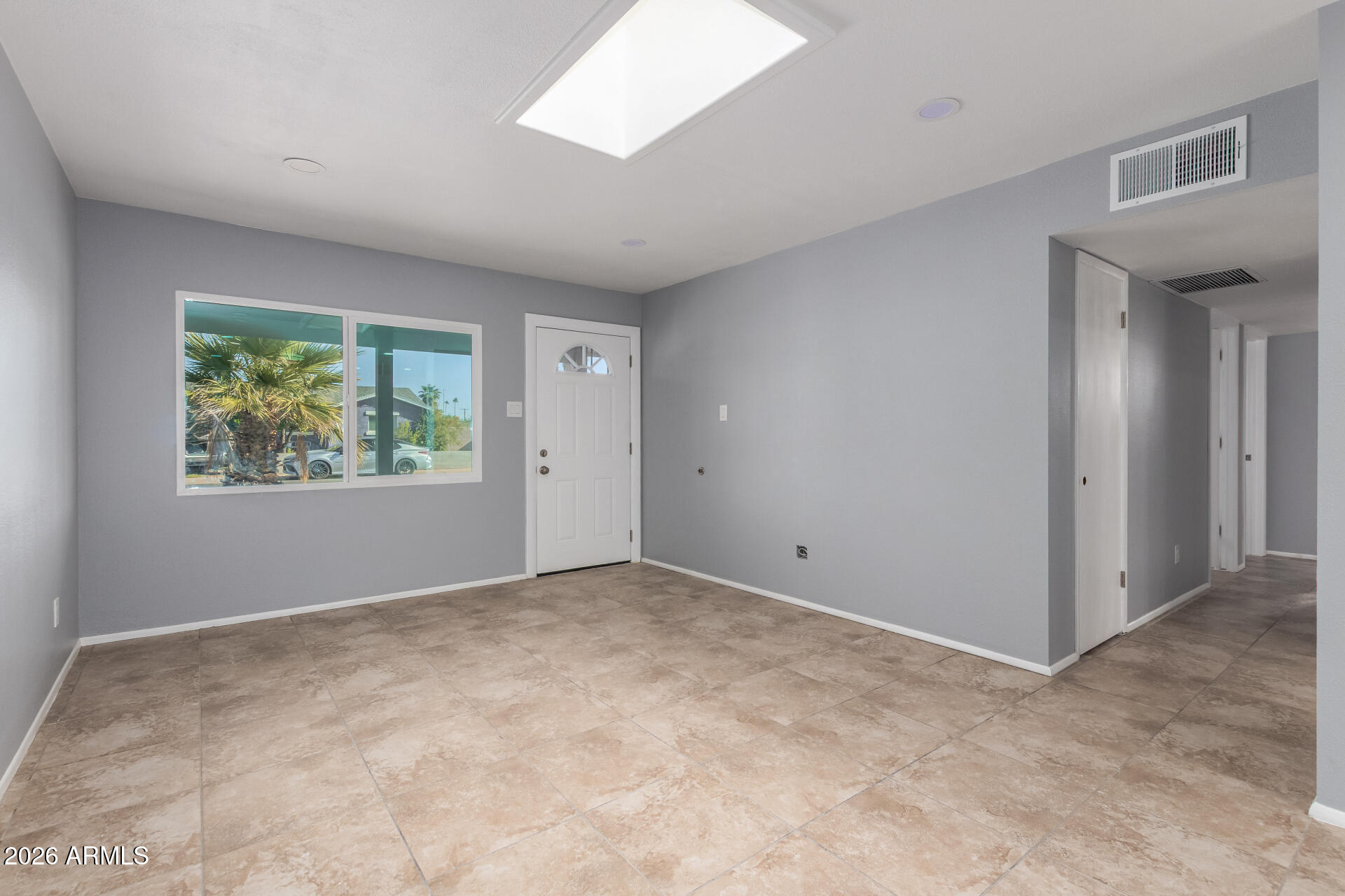3802 North 79th Avenue Phoenix, AZ 85033 - Photo 5 of 28 an empty room with windows