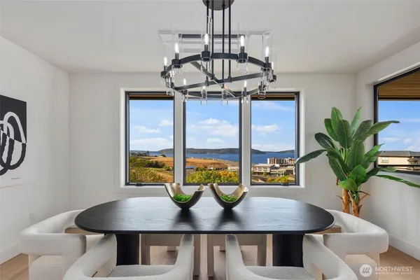 a view of a dining room with furniture window and wooden floor