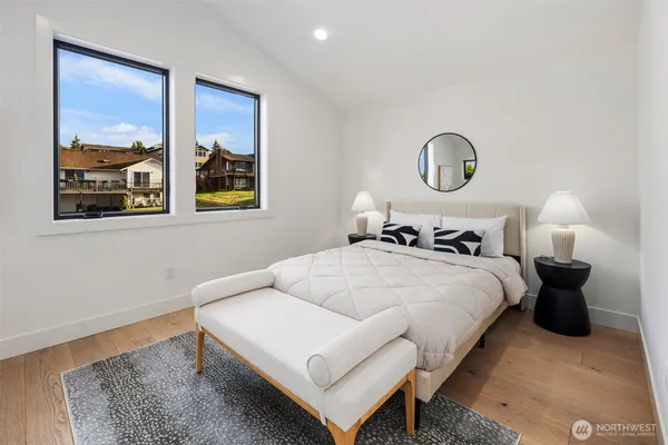 a bedroom with bed and a window
