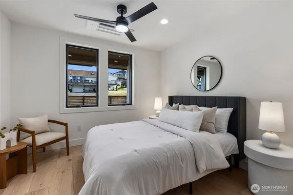 a bedroom with bed and a window