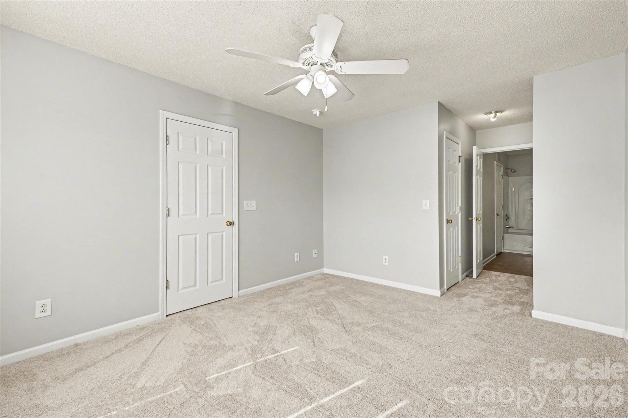 3201 Blythe Ridge Court Charlotte, NC 28213 - Photo 16 of 34 an empty room with fan and a ceiling fan