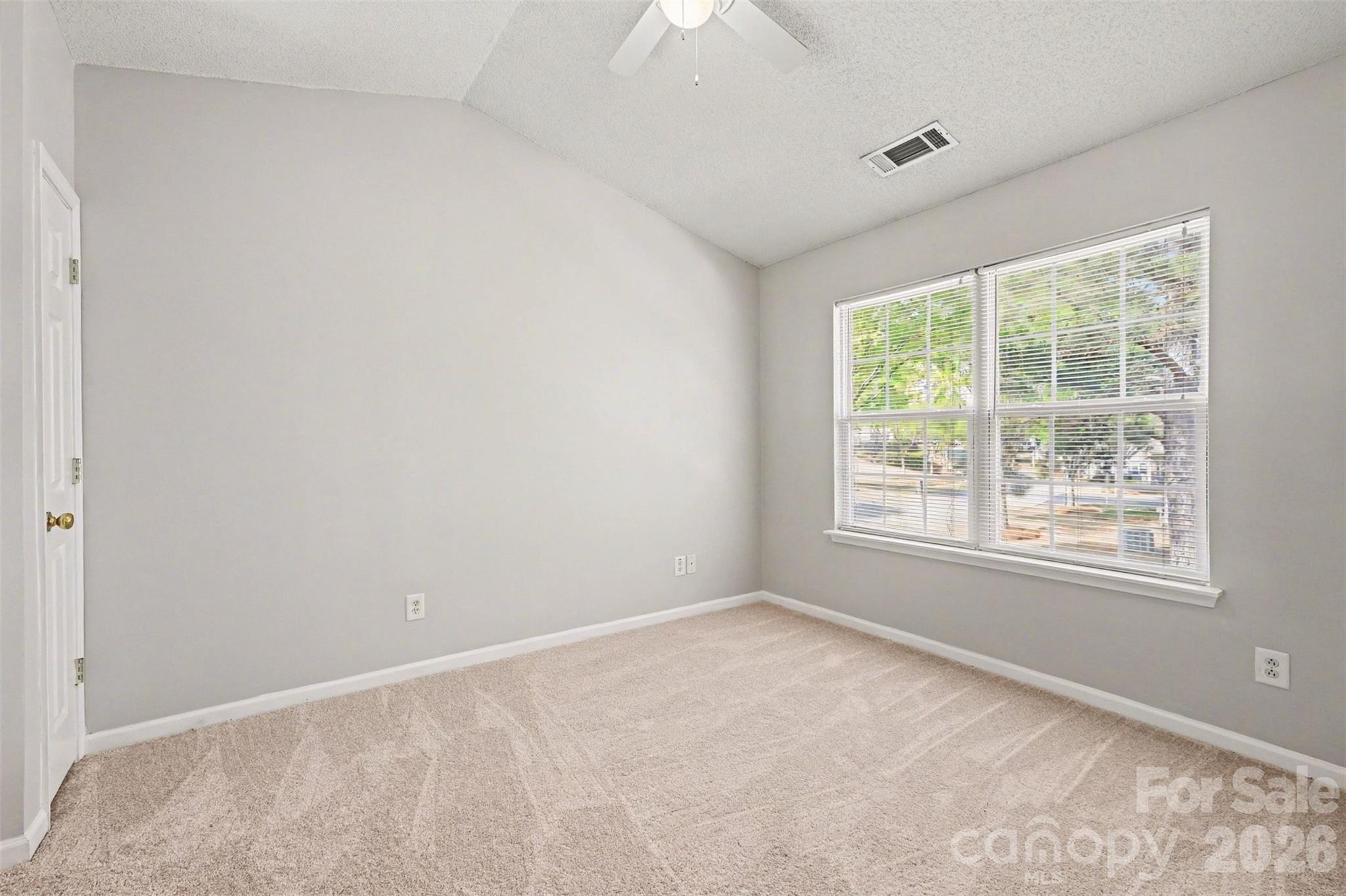 3201 Blythe Ridge Court Charlotte, NC 28213 - Photo 18 of 34 an empty room with a window