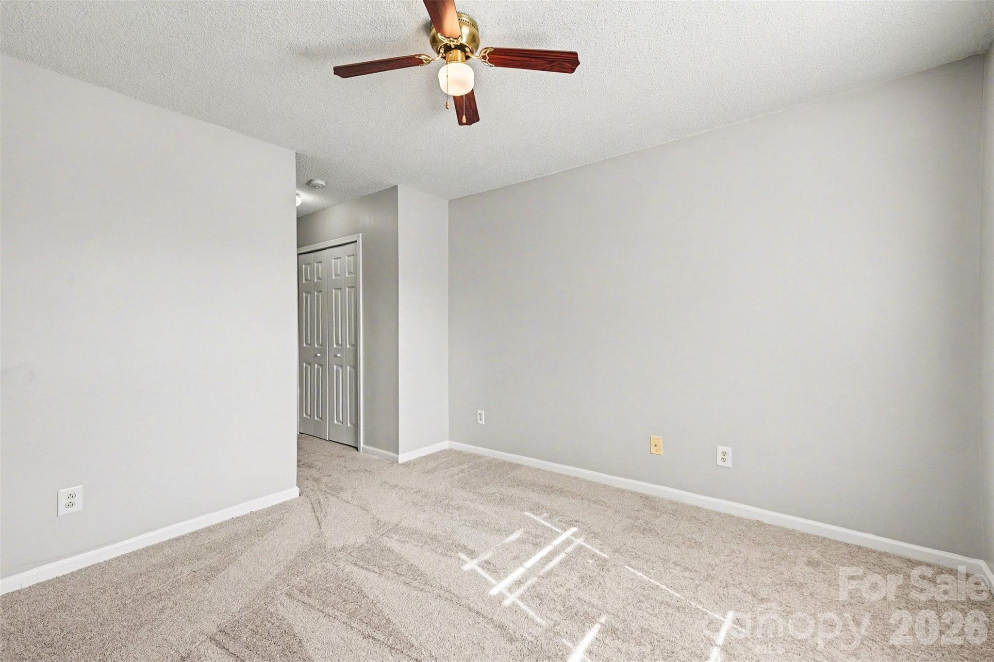 3201 Blythe Ridge Court Charlotte, NC 28213 - Photo 19 of 34 a view of a room with a ceiling fan