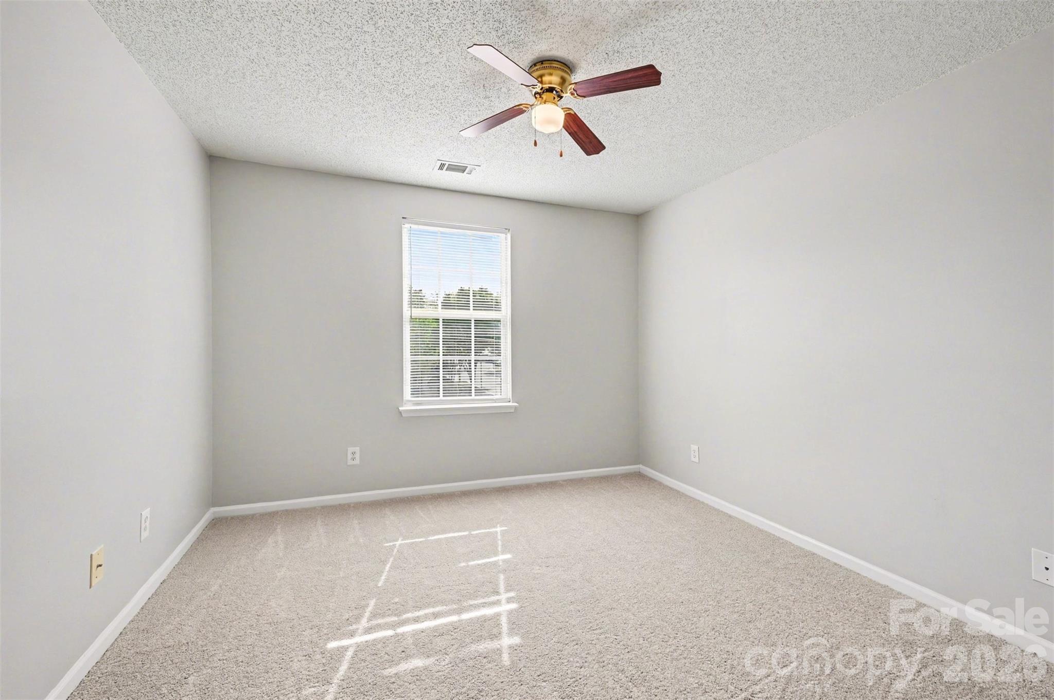 3201 Blythe Ridge Court Charlotte, NC 28213 - Photo 20 of 34 an empty room with a window