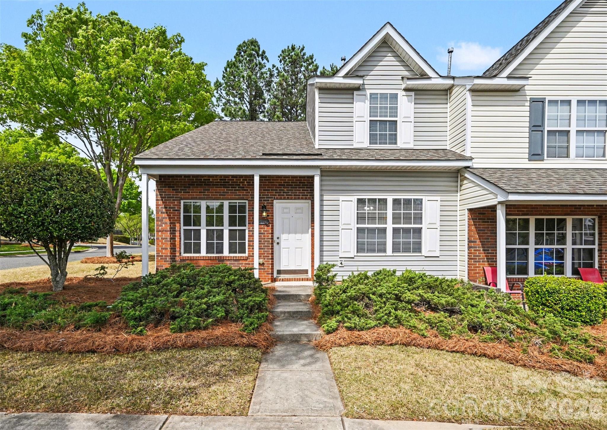 3201 Blythe Ridge Court Charlotte, NC 28213 - Photo 2 of 34 a front view of a house with garden