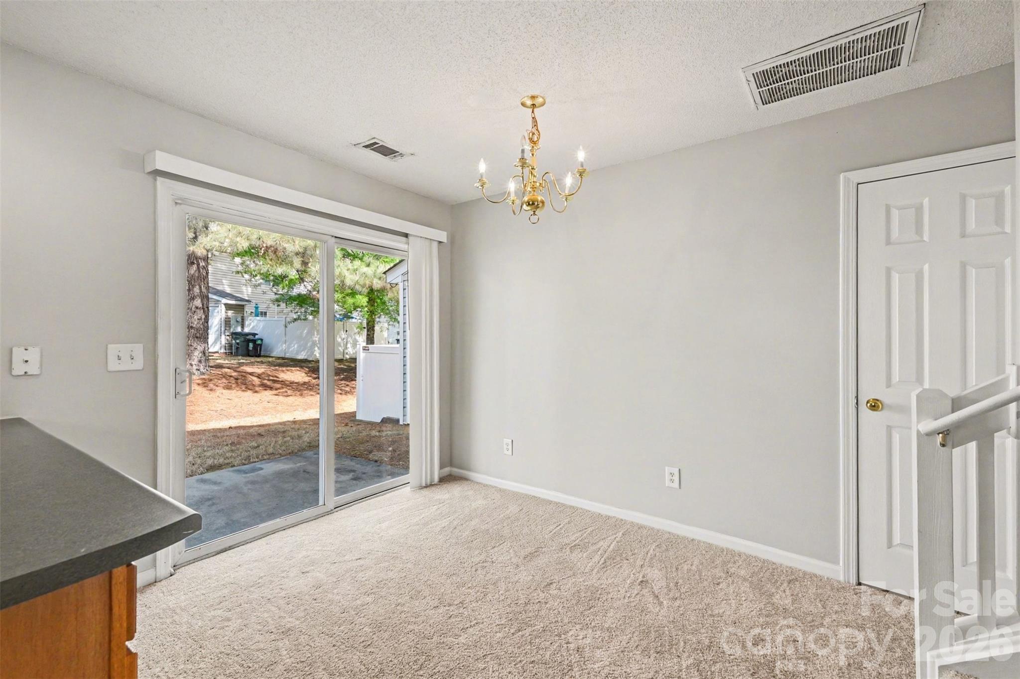 3201 Blythe Ridge Court Charlotte, NC 28213 - Photo 24 of 34 en empty room with windows and outdoor view