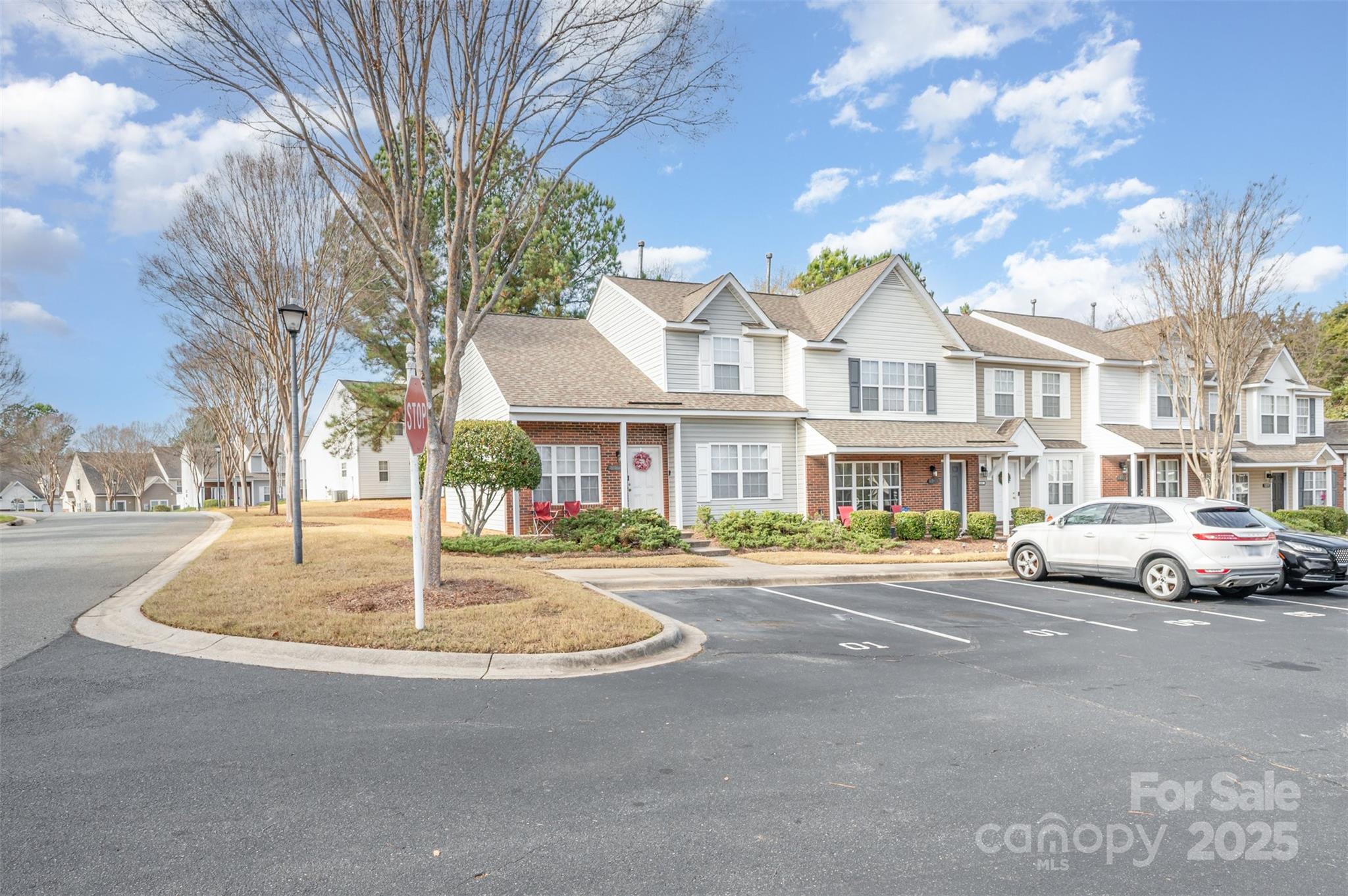 3201 Blythe Ridge Court Charlotte, NC 28213 - Photo 3 of 10 a front view of residential houses with yard and trees