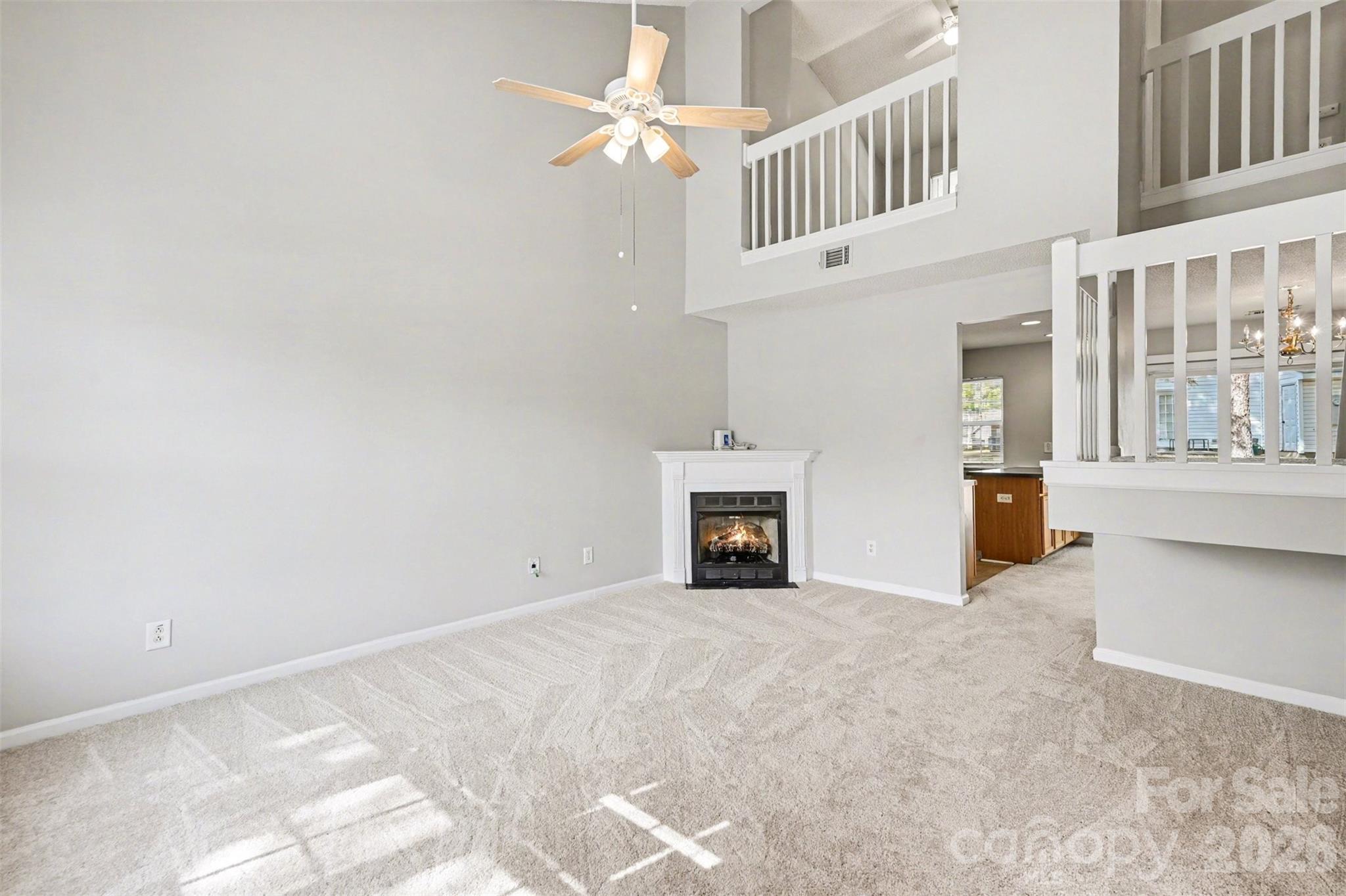 3201 Blythe Ridge Court Charlotte, NC 28213 - Photo 6 of 34 an empty room with windows and fireplace