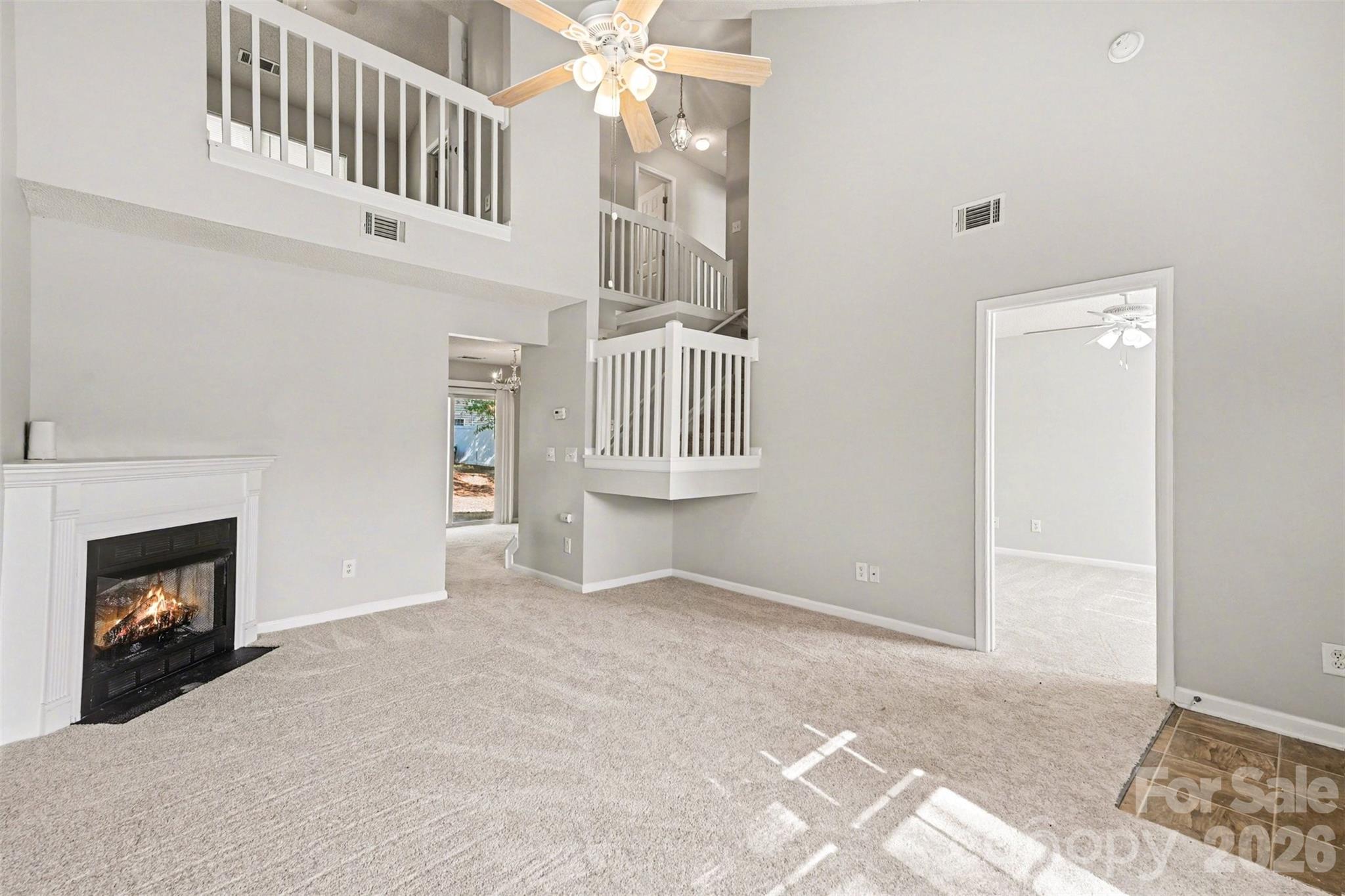 3201 Blythe Ridge Court Charlotte, NC 28213 - Photo 7 of 34 a view of an empty room with fireplace and wooden floor