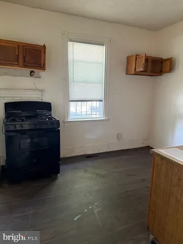 a living room with a fireplace and a window