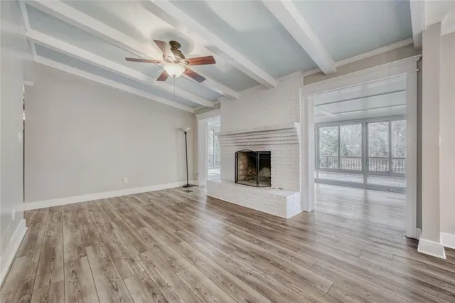 a kitchen with granite countertop a sink stainless steel appliances and cabinets