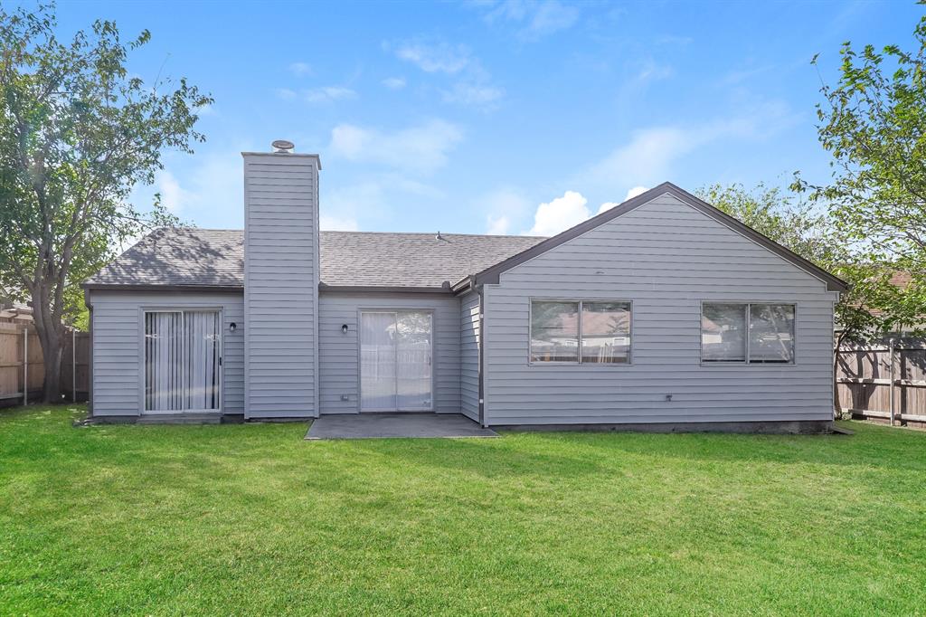 3805 Big Leaf Lane Fort Worth, TX 76137 - Photo 15 of 16 a front view of a house with a garden