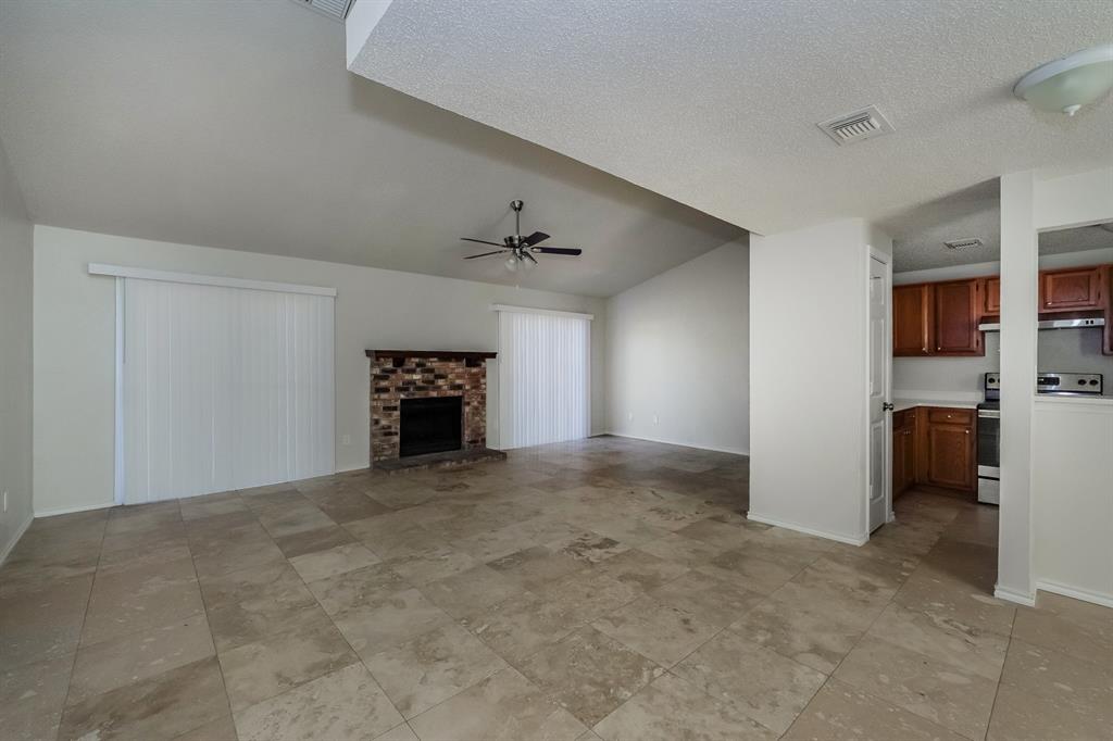 3805 Big Leaf Lane Fort Worth, TX 76137 - Photo 4 of 16 a view of a livingroom with a fireplace