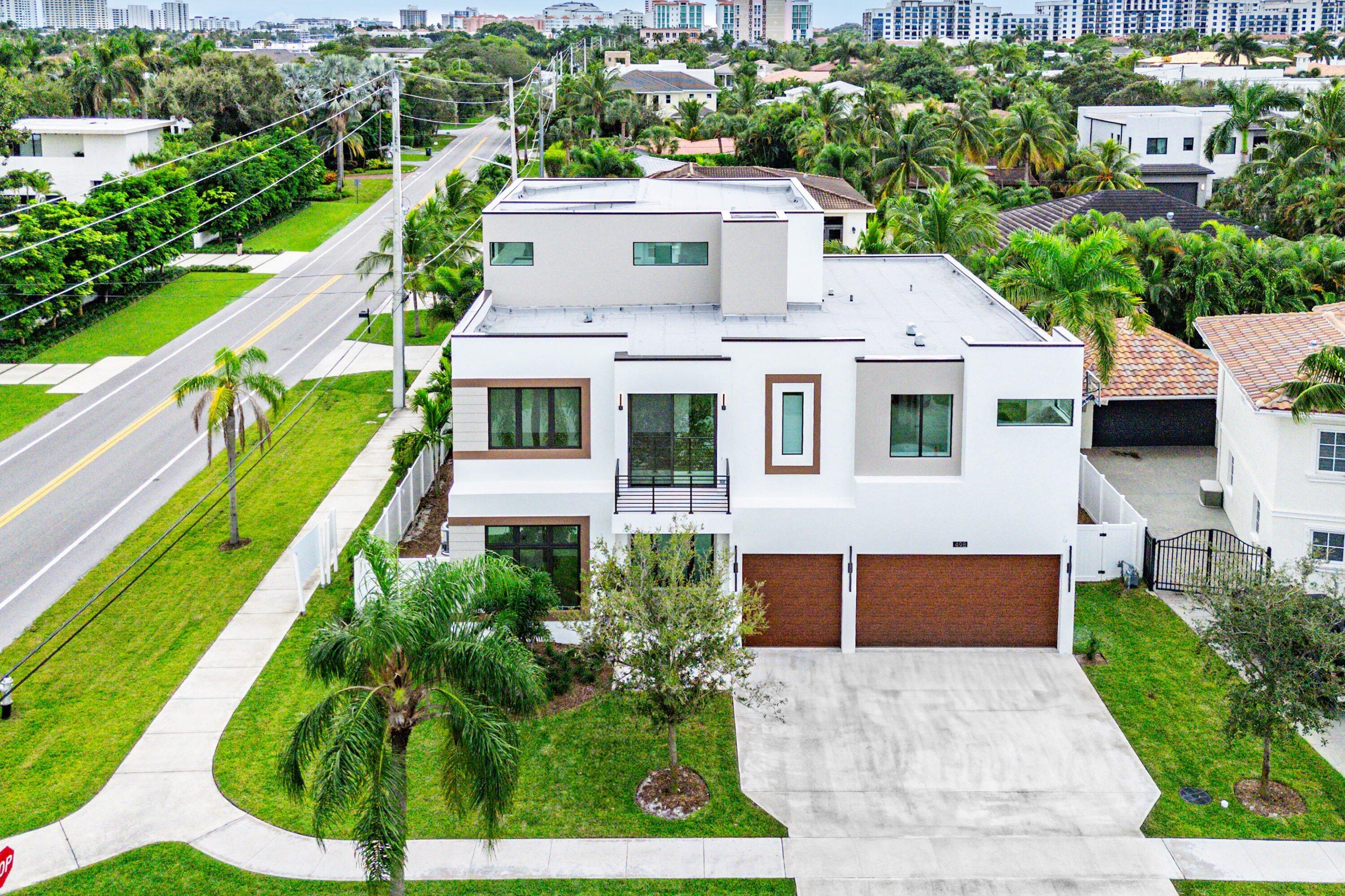498 Northeast 6th Street Boca Raton, FL 33432 - Photo 2 of 60 a aerial view of a house with a yard