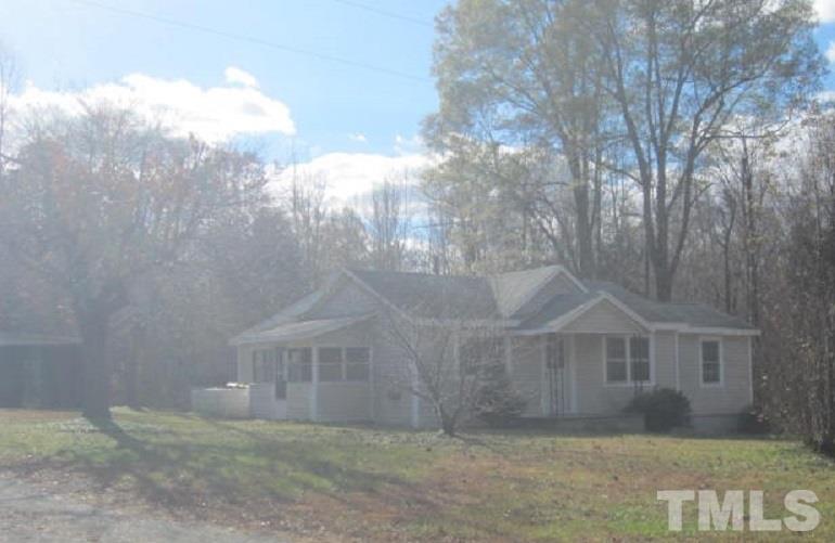 7866 Oxford Road Rougemont, NC 27572 - Photo 2 of 19 a view of a small yard in front of a house