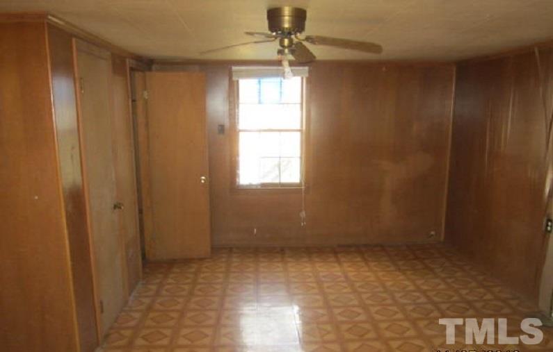 7866 Oxford Road Rougemont, NC 27572 - Photo 14 of 19 a view of an empty room with a window