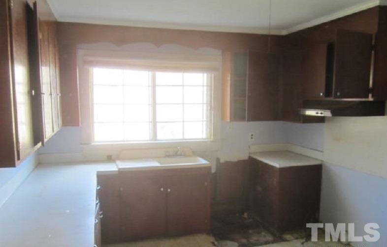 7866 Oxford Road Rougemont, NC 27572 - Photo 9 of 19 a bathroom with a sink and a bathtub