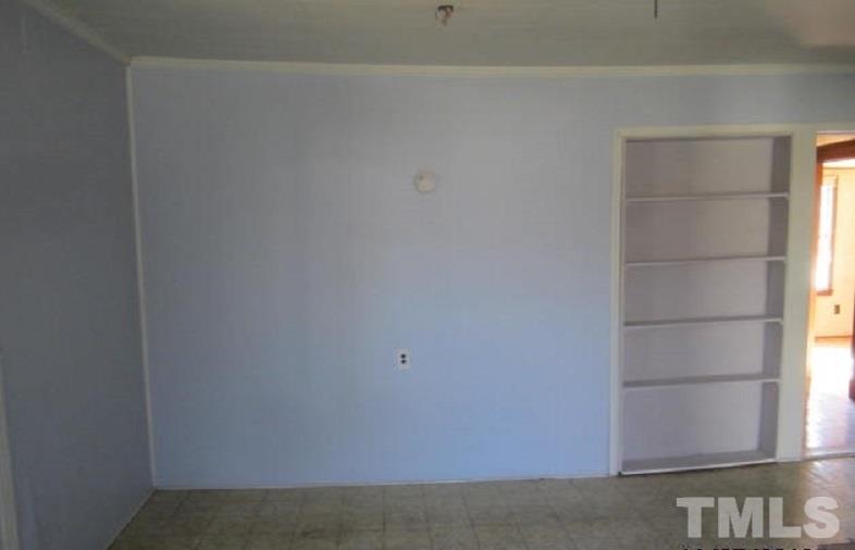 7866 Oxford Road Rougemont, NC 27572 - Photo 10 of 19 a view of an empty room with a window