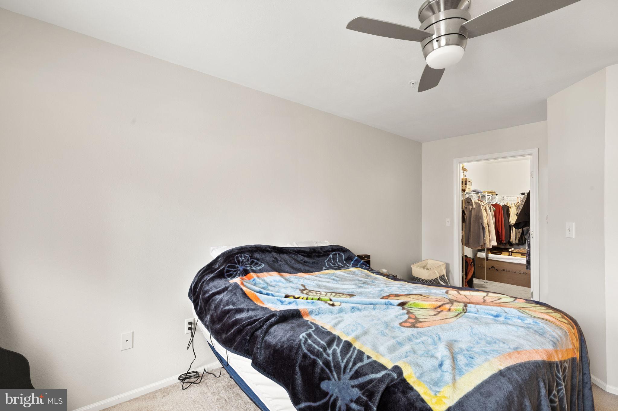 608 Churchill Road, Unit 608E Bel Air, MD 21014 - Photo 16 of 25 a bedroom with a bed and mirror