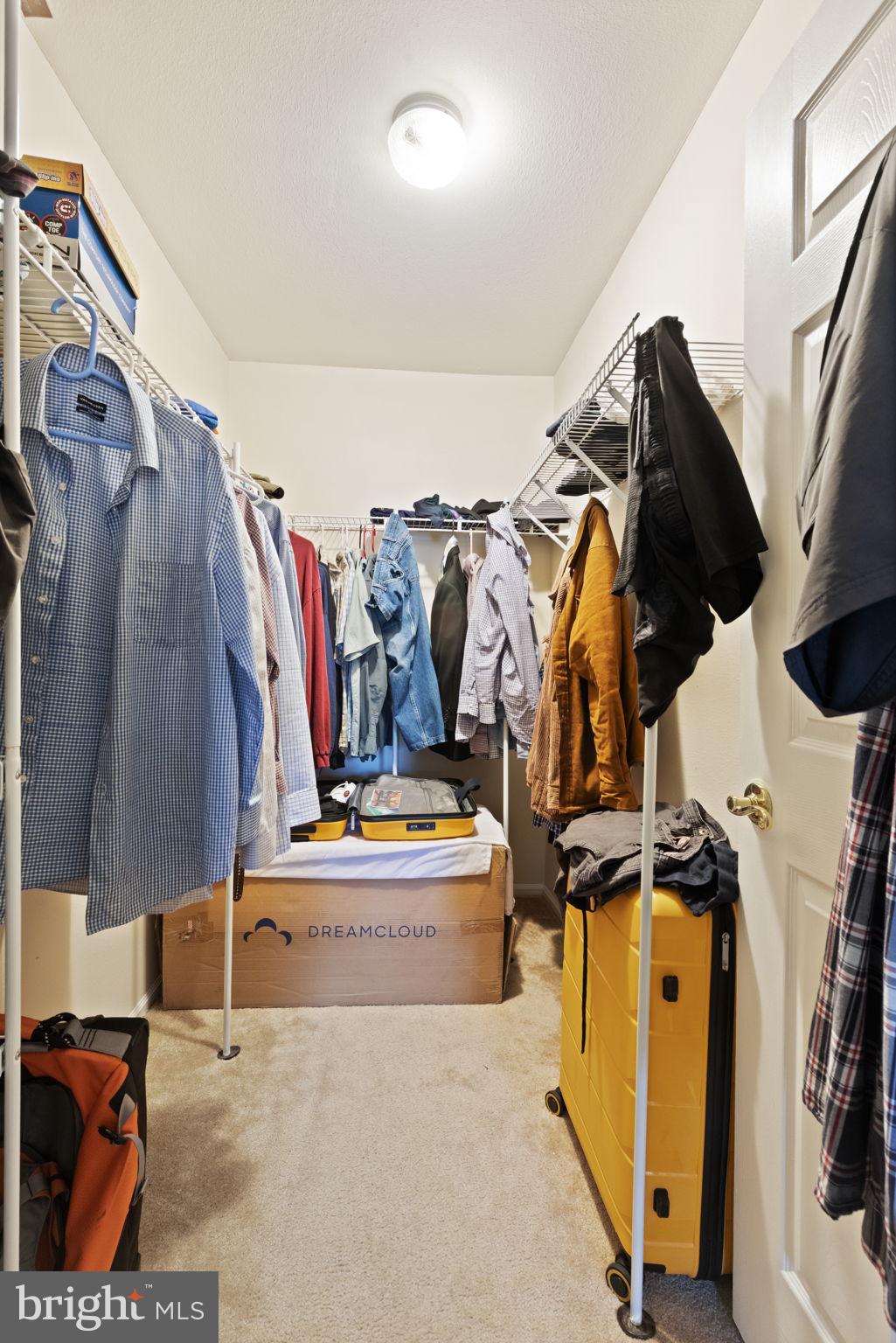 608 Churchill Road, Unit 608E Bel Air, MD 21014 - Photo 18 of 25 a view of walk in closet with clothes and shoes