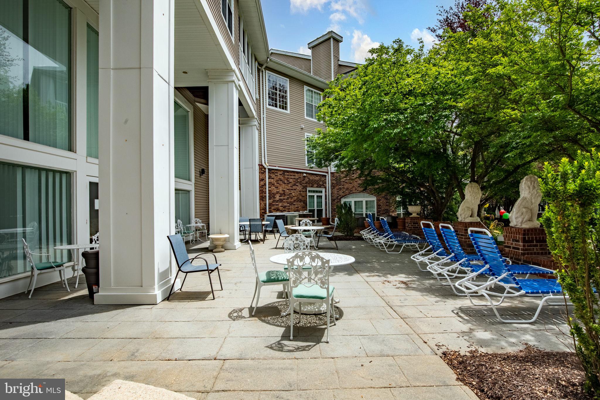 608 Churchill Road, Unit 608E Bel Air, MD 21014 - Photo 23 of 25 a view of the patio with dining table and chairs