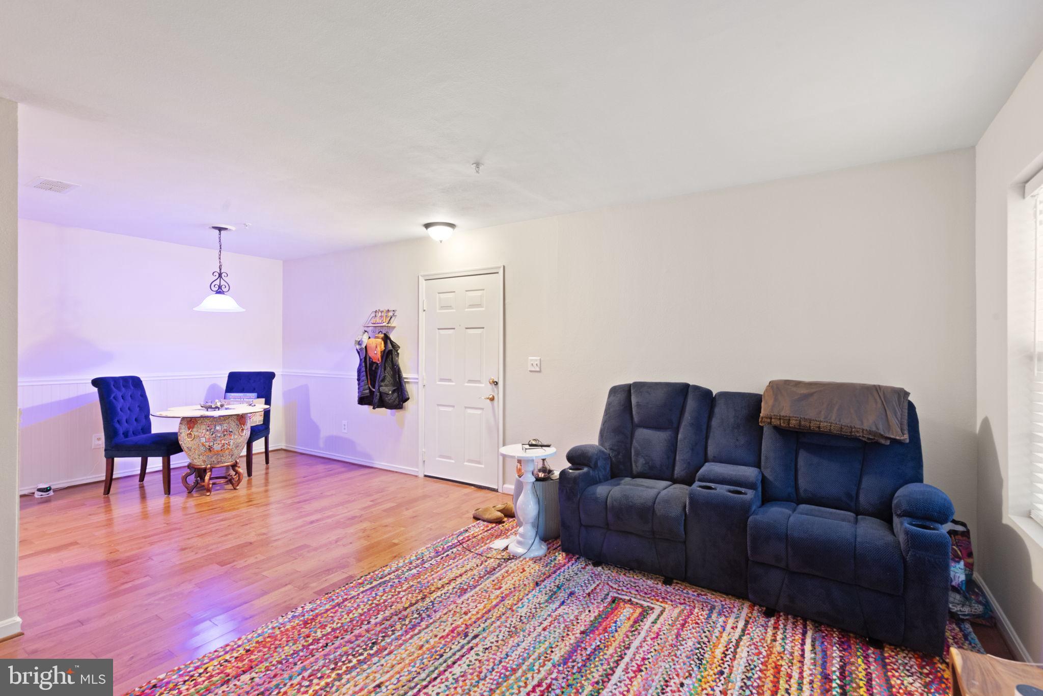 608 Churchill Road, Unit 608E Bel Air, MD 21014 - Photo 8 of 25 a living room with furniture and a wooden floor